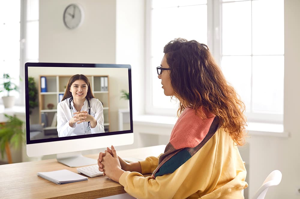 Woman speaking with healthcare provider on telemedicine